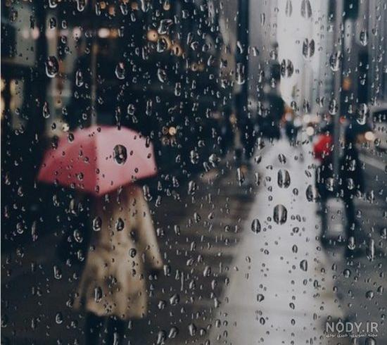 عکس دختر خوشحال زیر بارون عکس دختر خوشحال زیر بارون