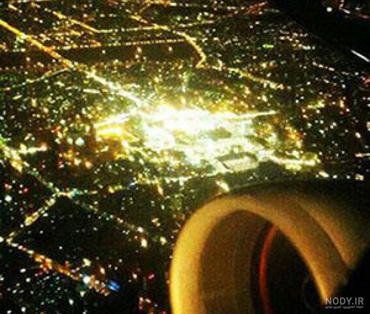 عکس از پنجره هواپیما در شب مشهد