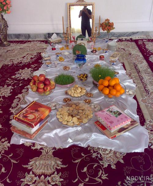عکس چیدن سفره هفت سین روی زمین
