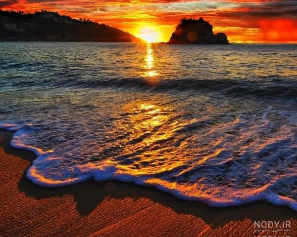 عکس طلوع خورشید کنار دریا