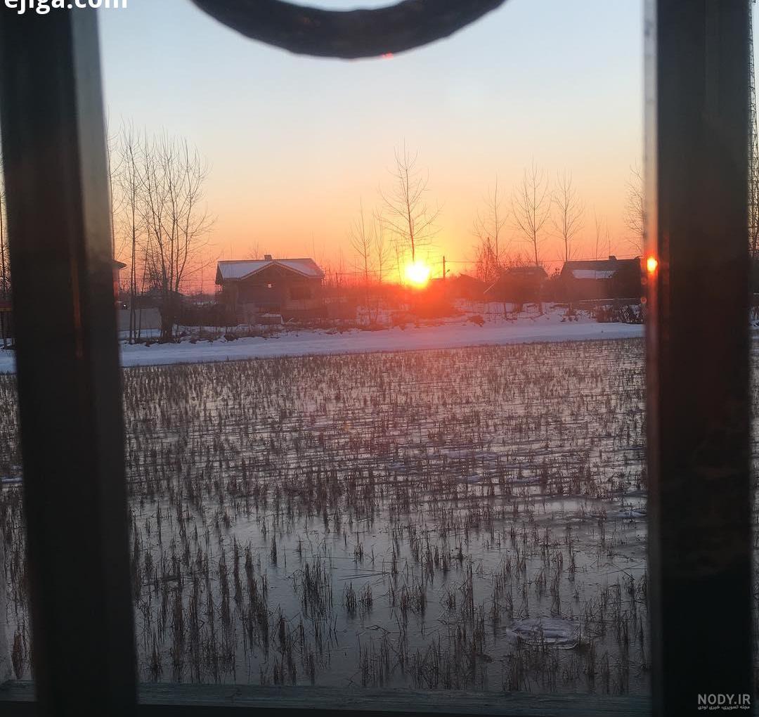 عکس طلوع خورشید از پشت پنجره