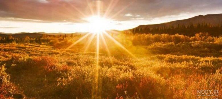 عکس طلوع خورشید از پشت پنجره