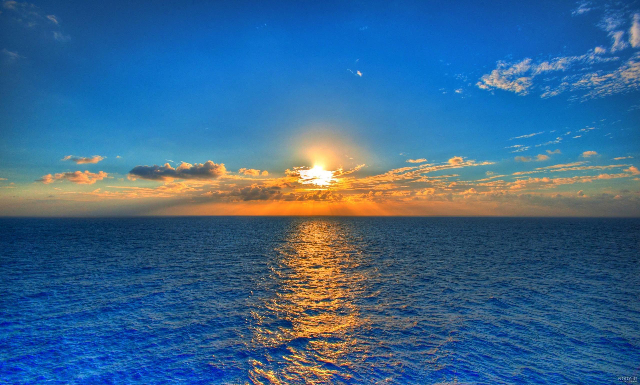 عکس طلوع خورشید دریا