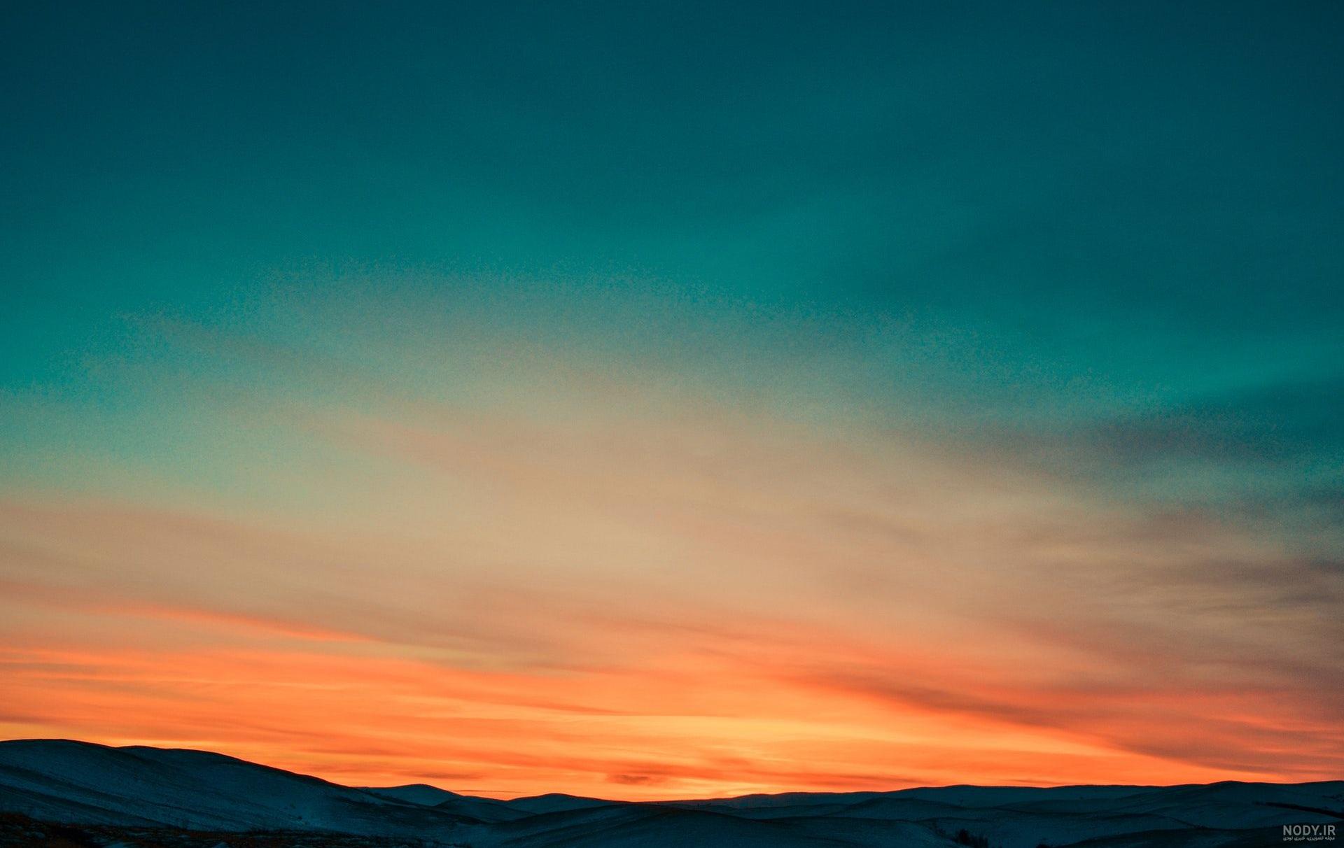  تصویر زمینه کوه برفی و غروب آفتاب