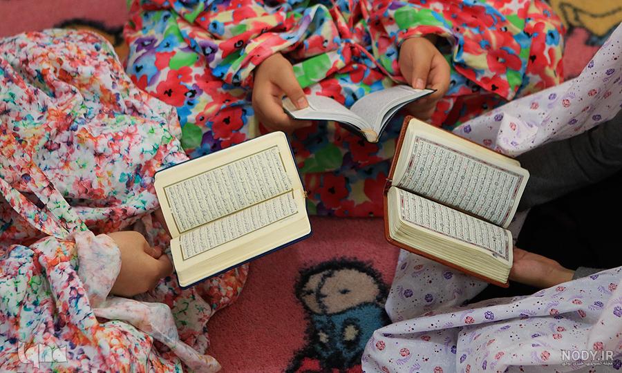 عکس قران در دست دختر عکس قران در دست دختر