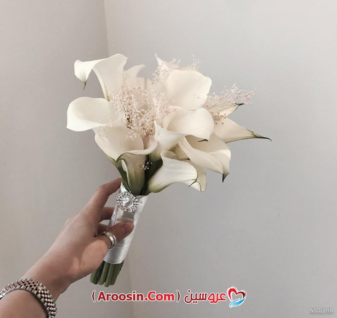دسته گل عروس رز قرمز با مروارید دسته گل عروس رز قرمز با مروارید
