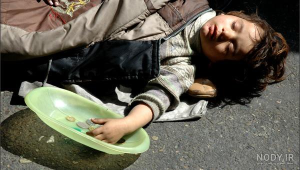 عکس کودک فقیر زیر باران