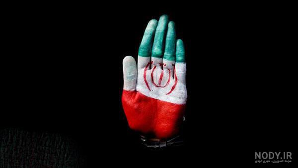 عکس نقاشی پرچم روی صورت عکس نقاشی پرچم روی صورت