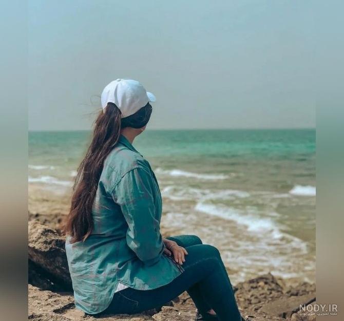 عکس دختر کنار دریا از پشت سر