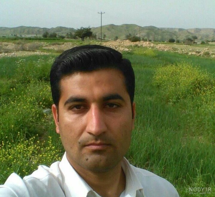 نجوای دلتنگی مادر شهید پور جلو با قاب عکس فرزند شهیدش