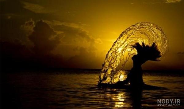 عکس طلوع خورشید از پشت پنجره