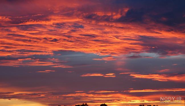 عکس طلوع خورشید از پشت پنجره