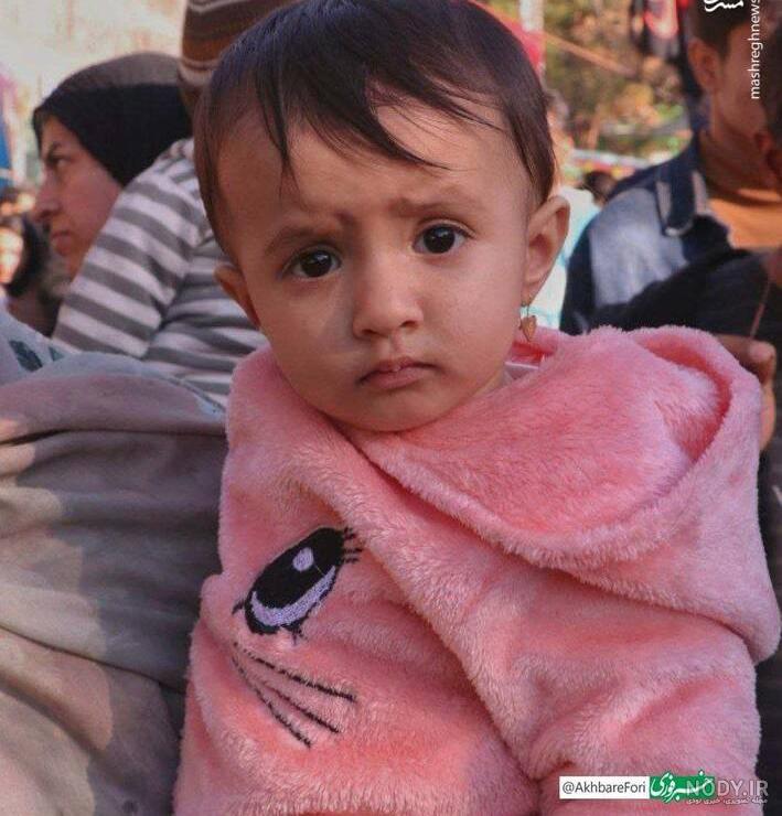 عکس ریحانه سلطانی نژاد دختر کاپشن صورتی با گوشواره قلبی