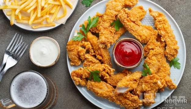 فرارو | طرز تهیه مرغ سوخاری پولکی؛ فیله استریپس فرارو | طرز تهیه مرغ سوخاری پولکی؛ فیله استریپس