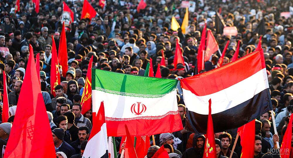 عکس حاج قاسم با پرچم ایران