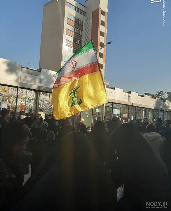 عکس حاج قاسم با پرچم ایران
