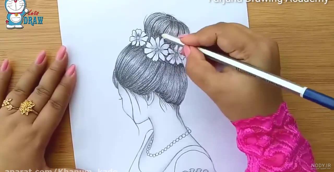 طراحی چهره پنهان یک دختر با کلاه زمستانی بکشیم
