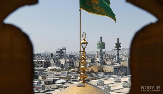 عکس: تعویض پرچم گنبد حرم مطهر امام رضا(ع) | پایگاه اطلاع رسانی رجا