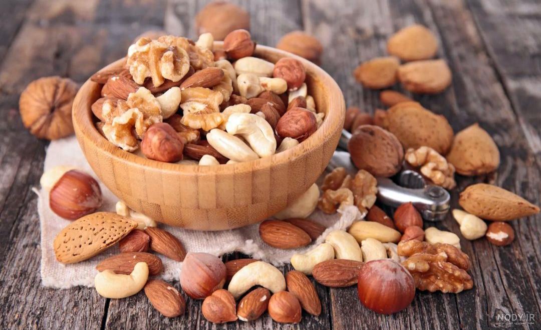 عکس با کیفیت آجیل های خوشمزه و تازه در ظرف اردور خوری چوبی زیبا ... عکس با کیفیت آجیل های خوشمزه و تازه در ظرف اردور خوری چوبی زیبا ...