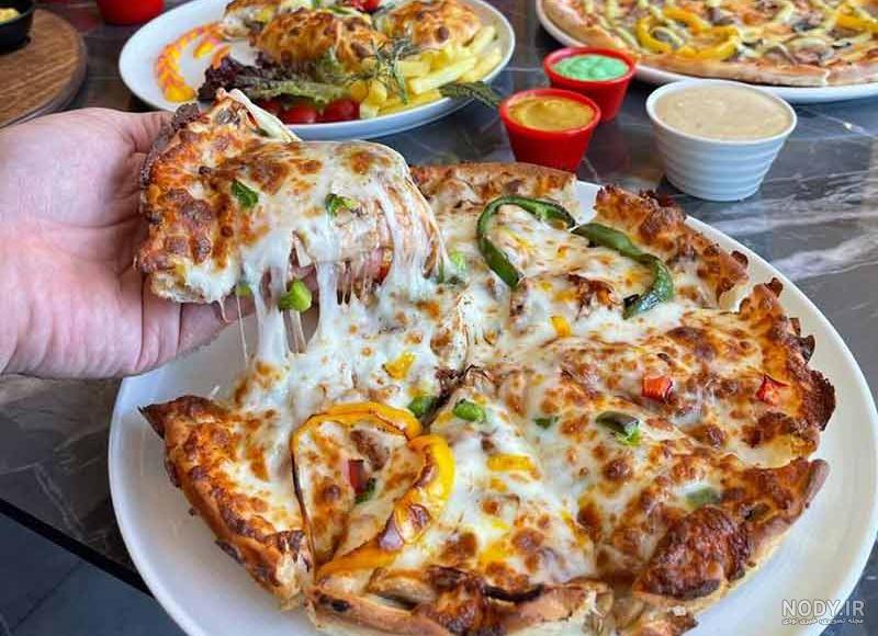بهترین پیتزا کرج کجاست؟ 🍕[لیست 10 تایی]⭐ شماره پیتزا فروشی - ایرانیجو