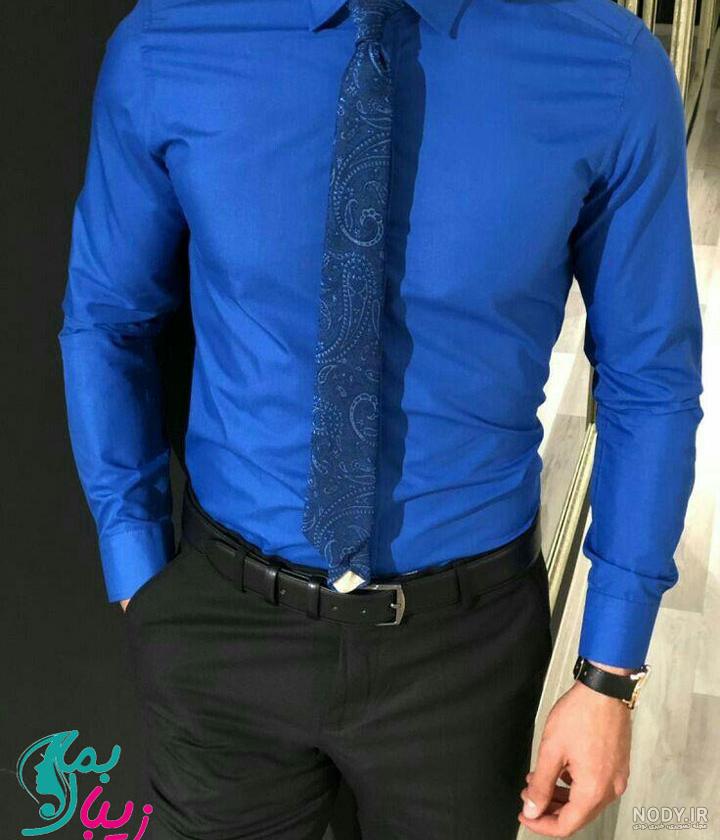 فروشگاه اینترنتیِ uob343i3 محصول|پیراهن مردانه آبی مدل VQ
