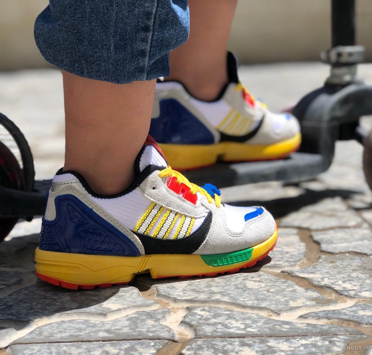 کفش کتونی سه خط آدیداس Adidas در 3 رنگ | مرکز خريد بزرگ ديبا کفش کتونی سه خط آدیداس Adidas در 3 رنگ | مرکز خريد بزرگ ديبا