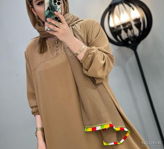 مانتو ابروبادی جلو دکمه نما قواره دار فروشگاه لباس سایز بزرگ زنانه آفتاب