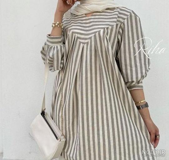 مانتو مشکی راه راه کد 988 - فروشگاه اینترنتی نازخاتون مانتو مشکی راه راه کد 988 - فروشگاه اینترنتی نازخاتون