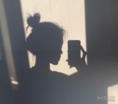 عکس سایه دختر در تاریکی