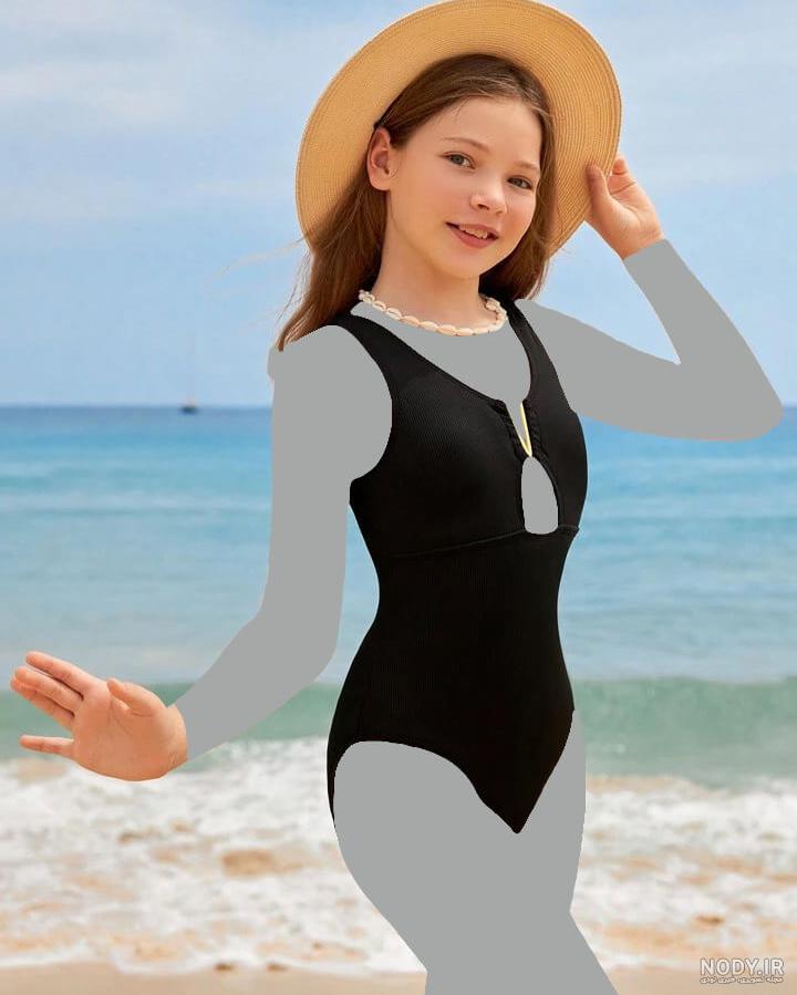 عکس زن در ساحل با مایو