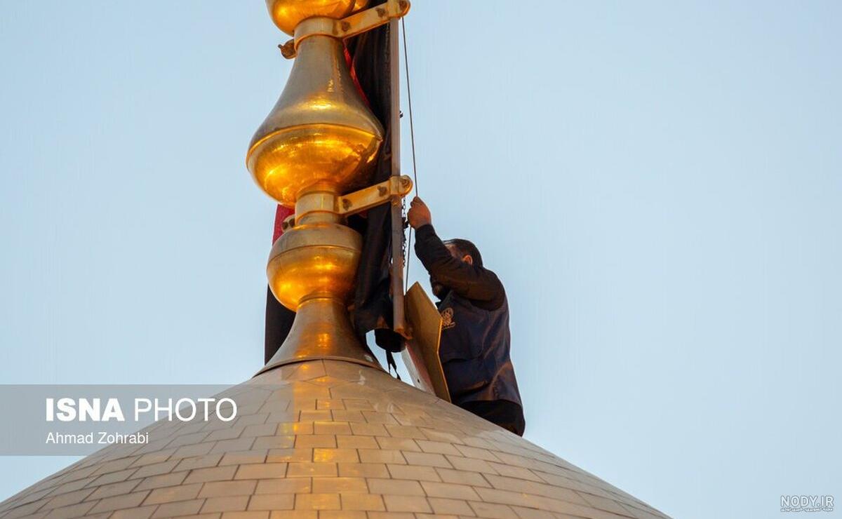 مشرق نیوز - عکس/ پرچم گنبد امام رضا(ع) به رنگ سیاه درآمد